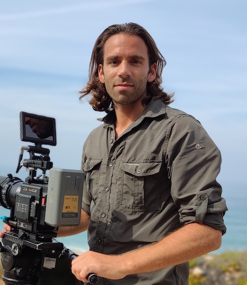 Wildlife Filmmaker Michael Sanderson of Ateles Films holding a red digital cinema camera on location