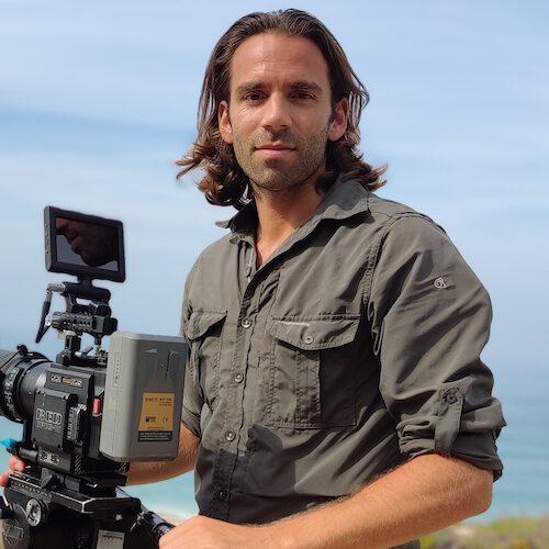 Wildlife Filmmaker Michael Sanderson of Ateles Films holding a red digital cinema camera on location